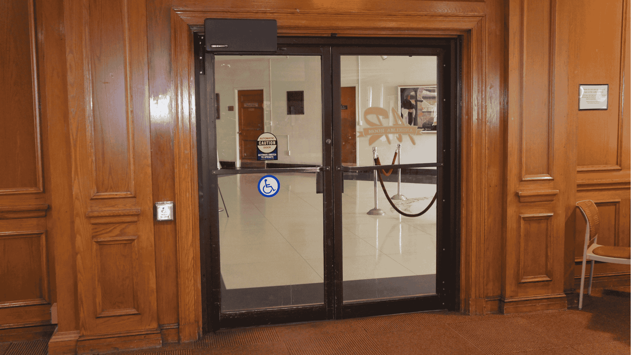 Model 4310L automatic door opener installed on a conference room door