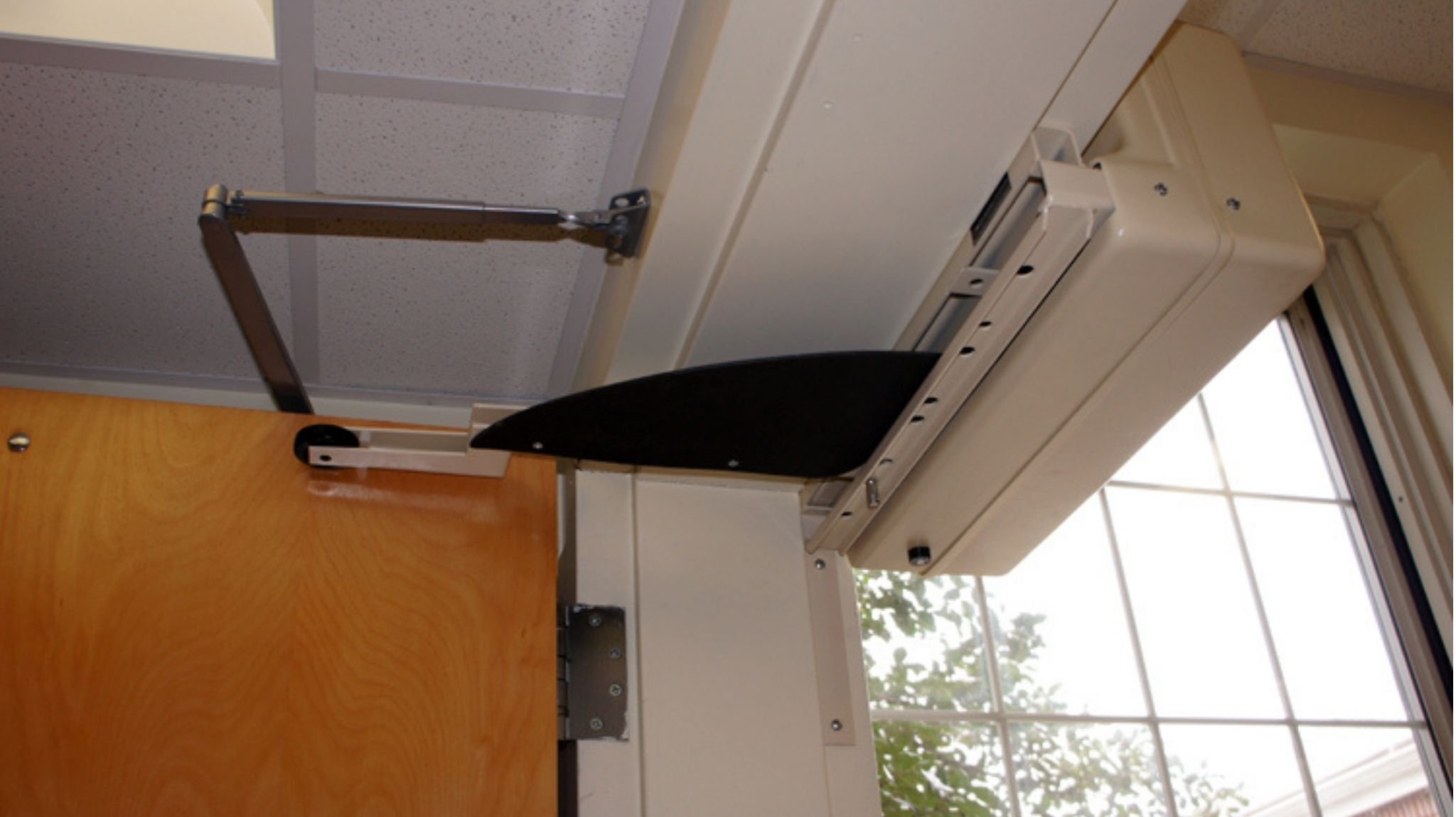 Up close of a Model 4300XR automatic door opener installed on an interior door